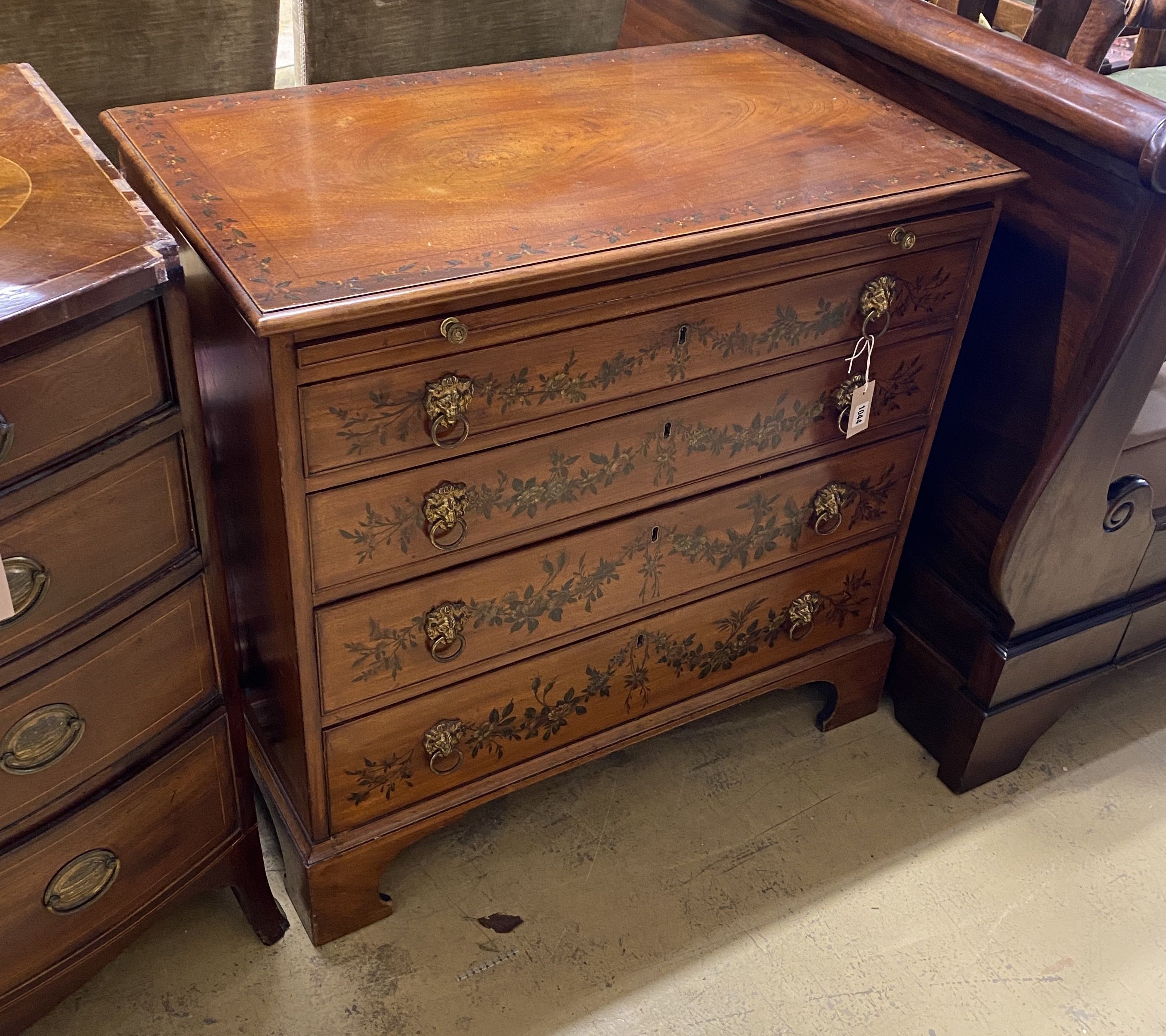 An early 20th century floral painted mahogany chest of drawers, fitted slide, width 90cm, depth 51cm, height 86cm